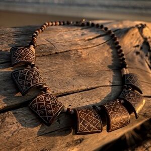 Hand Carved Bone necklace with unique geometric pattern and two tone beading
